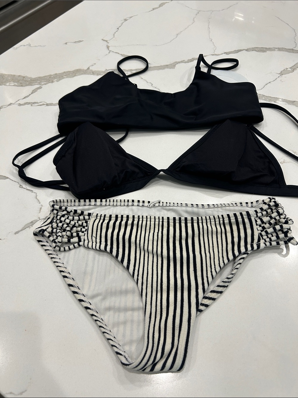 Black Bikini Tops with Black-and-White Striped Bottom which are billabong